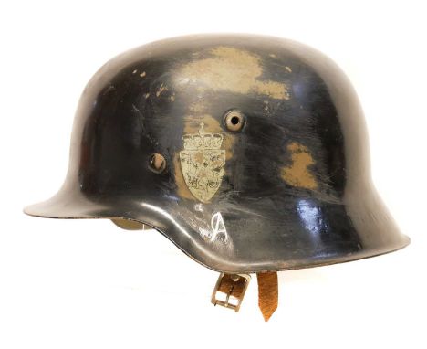 German helmet German WWII M42 helmet, reissued by the Norwegian military following WWII and bearing the lion and axe decals, 