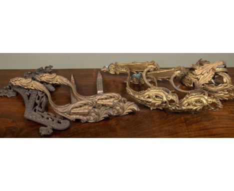 Two pairs of French gilt metal curtain pole brackets, each approximately 28cm high; together with twelve gilt metal curtain r