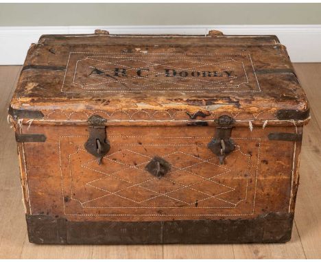 A 19th century leather and iron bound trunk with wrought iron carrying handles to the side and wrought iron hasps to the fron