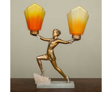 An Art Deco spelter and alabaster table lamp in the form of a dancing girl supporting two torchères in coloured glass, 45cm h