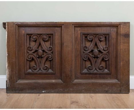 An old oak ornamental architectural double panel with scroll decoration, 147cm wide x 84cm highRemoved from part of a larger 