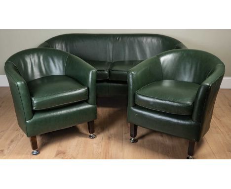 A contemporary green leather three piece suite consisting of a two seater sofa and two armchairs, all standing on square tape