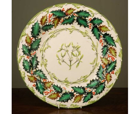 An early 20th century Copeland late Spode Christmas dish decorated in light relief with holly and mistletoe, 39cm diameterIn 