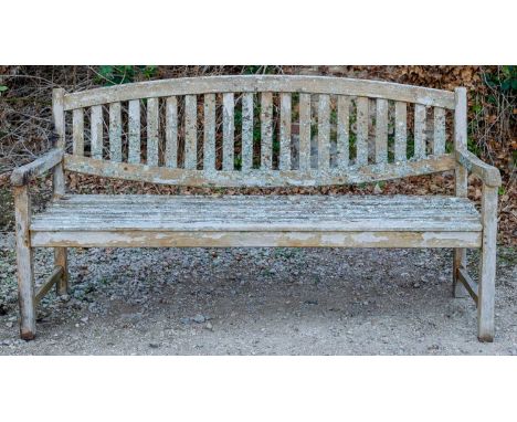 A teak garden bench with slatted back and seat, 180cm wide x 92cm highWeathered condition overall.
