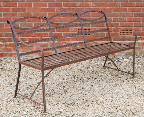 A Regency-style black painted wrought iron garden bench, 152cm wide x 87cm highOxidisation and wear to the paintwork overall,
