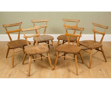 A set of six Ercol small elm chairs, five with a red dot to the reverse and one with a blue dot, 63.5cm high (6)General marks