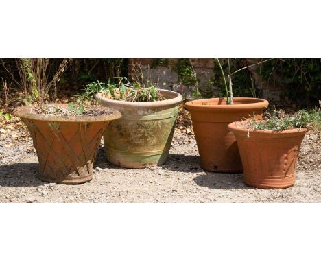 A basket weave terracotta planter, 50cm diameter x 33cm high, together with three further terracotta pots (4)All weathered an