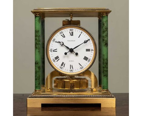 A Jaeger LeCoultre Atmos 'Vendome' table timepiece or clock, with faux marble columns to each corner, 21cm wide x 16cm deep x