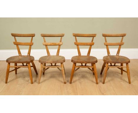A set of four child-sized Ercol light elm chairs with blank cartouche dots to the reverse, possibly from the yellow dot serie