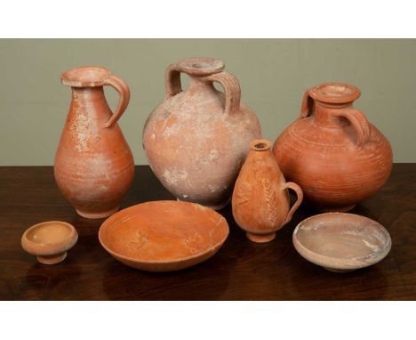 Four Roman terracotta flasks and three dishes, the largest flask 22cm high (7)From a deceased estate.Qty: 7All showing minor 