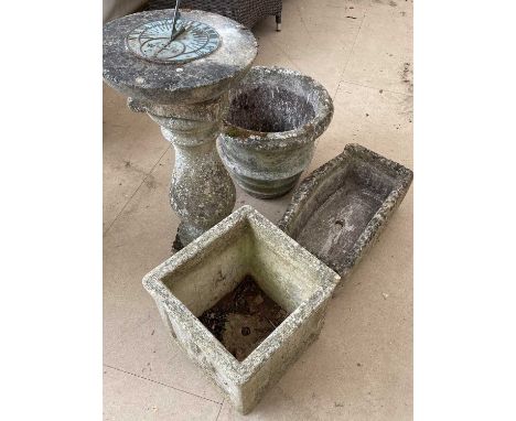 A cast reconstituted stone sundial, the circular top on a baluster support, 34cm diameter x 76cm high; together with three va