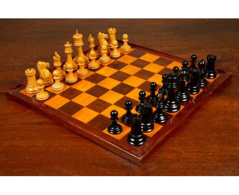 A Staunton club size chess set by Jaques of London, boxwood and ebony, together with the box and a chess board, the king 11cm