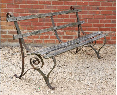 An old wrought iron bench with teak slats, 183cm wide x 84.5cm highOxidisation and wear to the paintwork overall, some slates