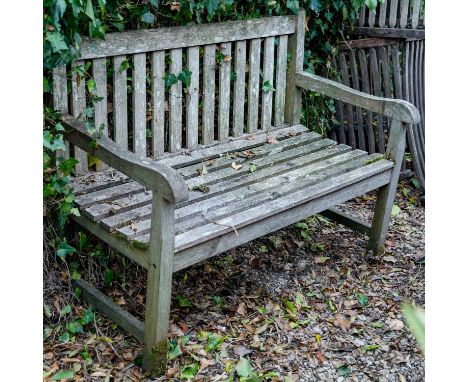 An old teak garden bench, 120cm wide x 86cm highWeathered condition. 