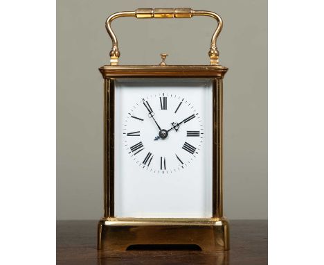A French Grande Sonnerie brass carriage clock with white enamel Roman dial, platform lever escapement, coiled gong strike wit