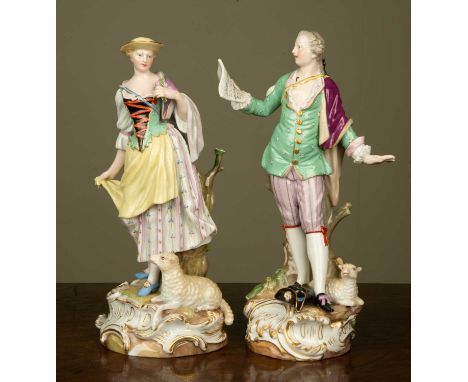 A pair of late 19th/early 20th century Meissen figurines depicting a gentleman singing to his belle, each figurine by a woody