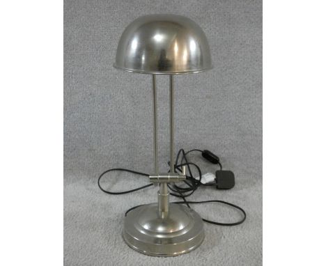 A vintage brushed metal adjustable desk lamp. H.47cm 