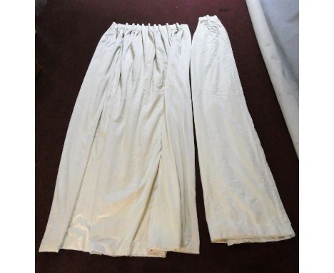 A pair of lined cream silk mix curtains with gathered tops. H.300x Widest point. 238cm 