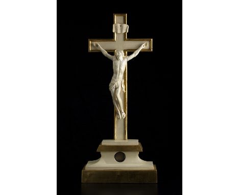 A carved ivory Reliquary Crucifix - France, late 18th / early 19th Century; ; standing on a gilt wood plinth base with wax se