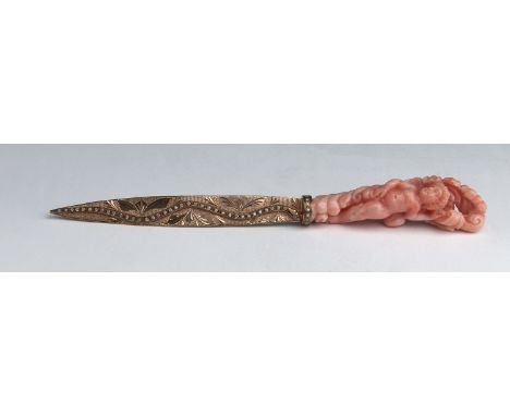 A gilt metal, diamonds and carved coral paper knife - early 20th Century; ; set with 53 huit huit roud cut diamonds. Lenght 1