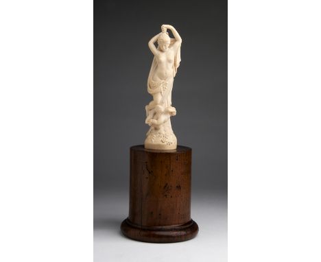 "Venus". A carved ivory Liberty figure - France,  19th Century; ; on a wooden base. 38.5 cm, 15 5/32 in high overall, weight 