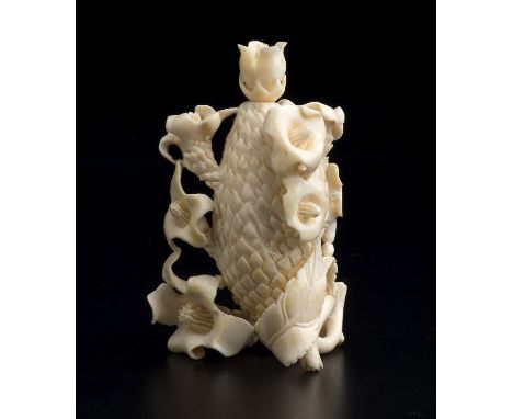 A vegetable carved ivory snuff bottle and stopper - China, 20th Century; ; finely carved exotic fruit shaped with three lines