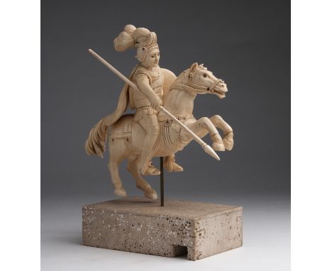 "Saint George". A carved ivory equestrian figure - Germany, 18th Century; ; on a travertine modern base. 28.5 cm, 11 7/32 in 