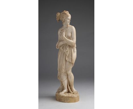 "Aphrodite Pudica". A carved ivory figure - France, 19th Century; ; 36.7 cm, 14 29/64 in high overall, weight 1607 gr. Item c