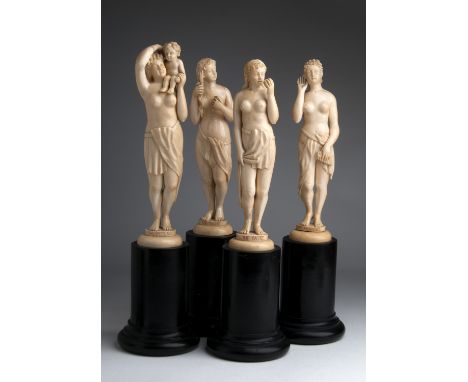 A carved ivory group of four female figures depicting "The Sight", "The Hearing", "The Taste" and "The Feeling" - probably En