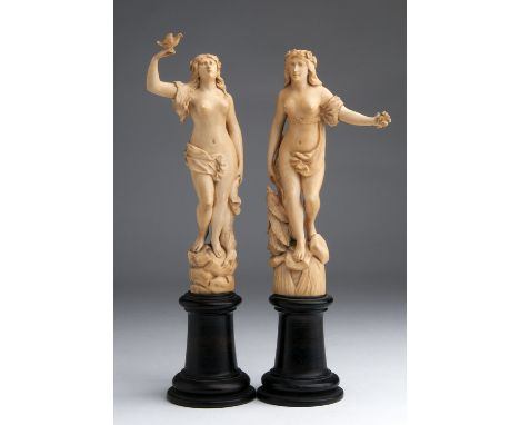 A pair of carved ivory figure of Nymphs - France, 19th Century; ; on a wooden base. 28 cm, 11 1/32 in high overall, weight 26