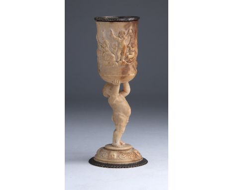 An ivory and Sterling Silver chalice ornately carved with Putti - John Figg, London 1844; ; fully hallmarked on the rim and t