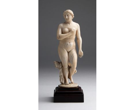 "Venus". A carved ivory - possibly Portugal, 17th Century; ; on a wooden base. 20.5 cm, 8 5/64 in high overall, weight 331 gr