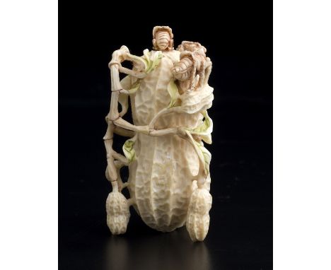 A vegetable carved ivory snuff bottle and stopper - China, 20th Century; ; finely carved peanut shaped with three insects on 