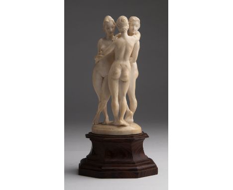 "The three Graces". A carved ivory figure group -  France,  late 19th / early 20th Century (pre-1947); ; on a wooden base. 23