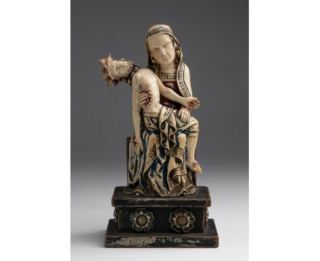 "Pietà". A carved ivory figure of Mary cradling the body of Christ - probably Flemish, circa 18th Century; ; with traces of o