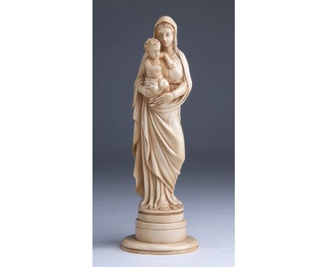 "Virgin and Child".  A carved ivory figural group  - probably France, 19th Century; ; on ivory base. 20 cm, 7 7/8 in high ove