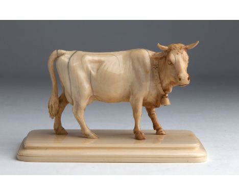 A carved ivory cow - probably England, early 20th Century (pre-1947); ; on ivory base, 9.6 cm, 3 25/32 in high overall, base 