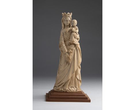 "Virgin and Child". A carved ivory figural group - probably France, late 18th Century; ; on a modern wooden base. 24.5 cm, 9 