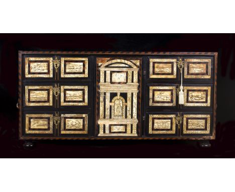 An ivory and ebony inlaid cabinet - Northern Italy, 17th / 18th Century; ; the central architectural door surrounded by an ar