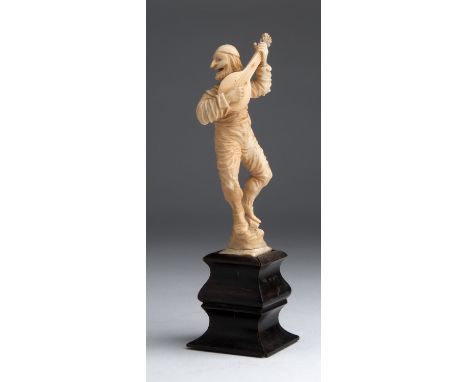 A carved ivory figure of a Minstrel - Naples, 18th / 19th Century; ; on a wooden base. 20 cm, 7 7/8 in high overall, weight 1