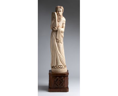 "Moses". A carved ivory figure - probably France, 19th Century; ; on a carved wooden base. 72.5 cm, 28 35/64 in high overall,