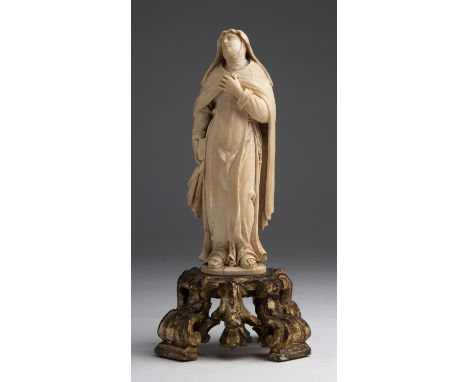 "Saint Therese of Avila". A carved ivory figure -  Flemish sculptor follower of Claude Beissonat, late 17th Century; ; on a g