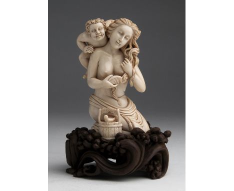 A carved ivory figural group depicting a young lady with a Satyr - P. Wood, Japan, late 19th / early 20th Century (pre-1947);