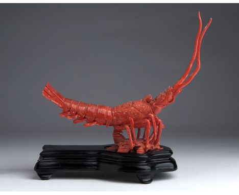 A carved coral sculpture depicting a Lobster - China, 20th Century (pre-1947); ; on a wooden base. 26.5 cm, 10 7?16 in high o
