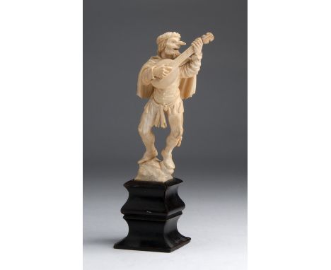 A carved ivory figure of a Minstrel - Naples, 18th / 19th Century; ; on a wooden base. 20 cm, 7 7/8 in high overall, weight 1