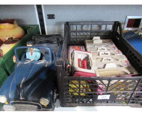 A model car, together with a box of die cast cars