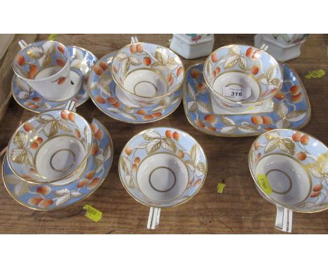 A group of 19th century English porcelain, comprising six cups, three saucers and a rectangular dish, all decorated with stra