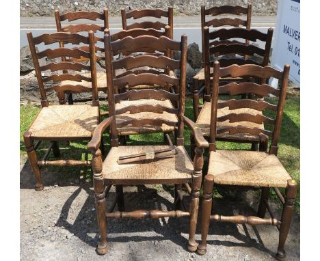 A set of 8 (7+1) ladder back dining chairs, with rush seats