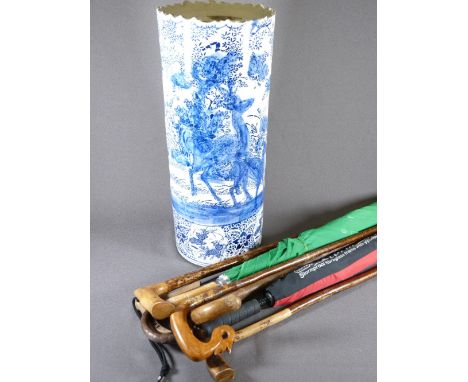 BLUE &amp; WHITE POTTERY STICK STAND with quantity of canes and umbrellas, 54cms H