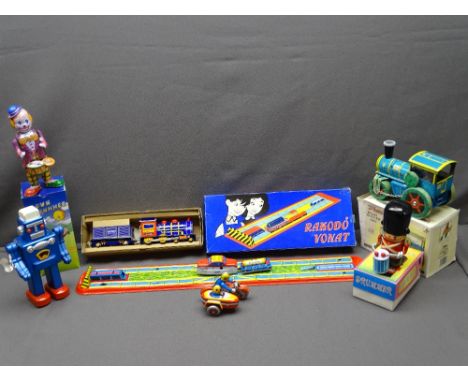 TIN PLATE TOYS, boxed, including a steam locomotive, clown drummer, road roller ETC